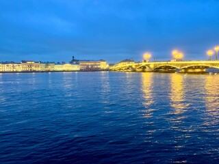 Wall Mural - Night city riverside, city lights at the river, blue twilights