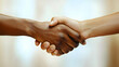 © HQAsset - Close-up Photo of Two Diverse Hands Clasping in a Firm Handshake, Symbolizing Unity and Agreement