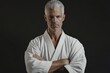 © Anton - Karate Master: Adult Caucasian Athlete with Black Belt Posing in Martial Art Background