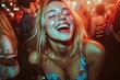 © Hanna Haradzetska - Portrait photo of a 23-year-old white woman with glitter on her face and a wide, uninhibited laugh, visibly tipsy, dancing in a crowded nightclub