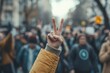 © ChaoticMind - A person's hand showing a peace sign in a protest crowd, symbolizing unity and resistance, reflecting the modern socio-political climate of activism and hope.