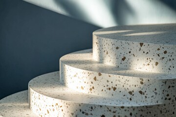 Poster - A stairway designed using terrazzo material with geometric precision, illuminated by natural light creating an interplay of shadows on the steps for an artistic effect.