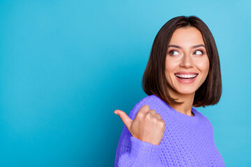 Wall Mural - profile side view portrait of attractive cheerful girl demonstrating copy space ad new isolated over