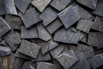 Aufkleber - An arrangement of dark stone slate tiles creates an overlapping pattern, presenting a rugged, natural look that emphasizes their rough, textured surface.