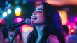 © Tamara - A beautiful young woman with long black hair sings into the microphone at a karaoke bar