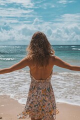 Canvas Print - Woman is standing on the beach with her arms outstretched, enjoying the ocean view. Concept of relaxation and freedom, as the woman is embracing the beauty of nature