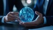 © GoodandEvil - Digital connected globe held by hands in a meeting