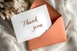 © Aisya - Thank you card in an envelope.