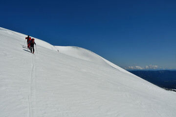 Wall Mural - Climbing Llaima Vulcano with ski toptouring strong wind storm Chile