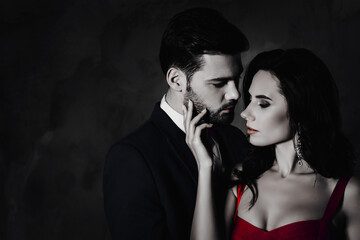 Poster - Portrait of naughty romantic couple looking at each other gentle touch, pretty charming brunette lady harsh bearded hispanic gentlemen isolated on grey background with copy space. Intimacy concept