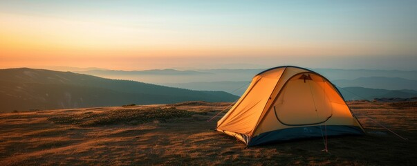 camping tent set against a stunning sunset.