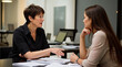 © HUMAN STUDIO - Women Discussing Business in Office