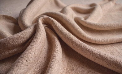 Poster - Piece of fabric with a pattern on it. The fabric is tan in color. The fabric is folded in half