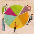 © IKON Images - Women examining investment pie chart