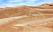 © Jim Glab - Hikers at Great Sands Dunes National Park, Colorado