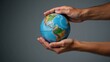 © Pixel Matrix - Hands holding a blue earth globe represent ecofriendly action and global sustainability