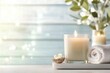 © olegganko - Relaxing ambiance with candles and towels in a serene indoor setting for wellness