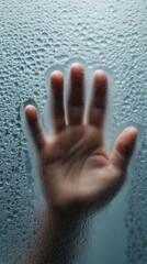 Wall Mural - Hand pressed against a foggy glass surface, creating a mysterious and intriguing effect, AI