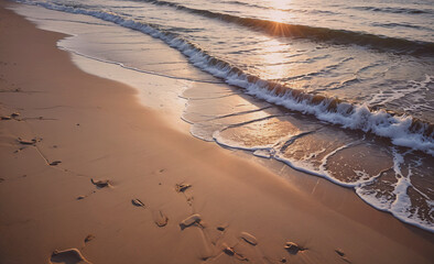 Poster - The beach is sandy and the water is calm. The sun is setting and the water is reflecting the light
