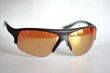 © Ева Поликарпова - A pair of sunglasses placed on a white surface, ready for use