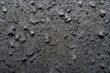 © wolfhound911 - Fine volcanic rock texture, porous dark gray with visible small pits and rugged edges, earthy and bold
