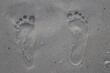 © Dmitrii - Footprint in sand men feet on sand foot steps barely foot finger stamp prints