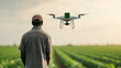 © alexandra_pp - A farmer in a cap observes an AI-controlled drone hovering over a vast crop field under a soft, overcast sky, highlighting the role of advanced technology in modern precision agriculture.