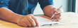 © aFotostock - Banner Businessman hands note meeting document in conference room. Banner man Hands writing planning notebook. Close up male hand holding pen write on diary sketchbook at office desk with copy space