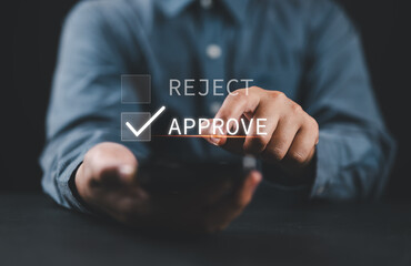 Poster - Businessman using smartphone to tick correct sign mark on approve check box for quality document and project approval concept.