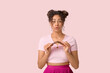 © Pixel-Shot - Surprised young African-American woman broke bar of chocolate on pink background