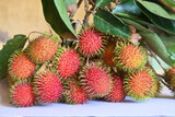 asian fruit rambutan on the plain background. Rambutan is tropical fruit and native Southeast Asia, juicy and sweet taste