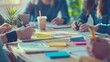 © phy - A collaborative session with people around a table, sharing notes, and ideas in a productive environment.