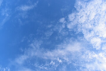 Wall Mural - beautiful blue sky and white fluffy group of clouds with sunrise in the morning, natural background