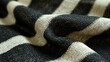 A fashion garment crafted from stretchable fabric featuring white stripes on a dark gray base for a sleek look