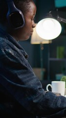 Poster - vertical video close up on video editor putting headphones on in order to polish raw footage and imp