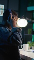 Poster - vertical video video editor adds sound effects to filmed footage, working in home studio. videograph