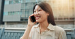 © peopleimages.com - Phone call, happy and woman in city for travel, vacation or weekend trip with direction board. Communication, cellphone and Japanese female person on mobile conversation for networking o holiday.
