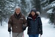 © Dassen - Active  senior couple walking in snowy forest with ski poles, displaying joy, embodying a healthy, retired lifestyle