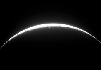 A black background with the moon's curved rim glowing in white, creating an otherworldly effect.