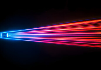 Wall Mural - A vibrant light beam with multiple colors of red, blue, and purple against a black background.