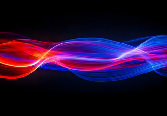 Wall Mural - A vibrant light beam with multiple colors of red, blue, and purple against a black background.