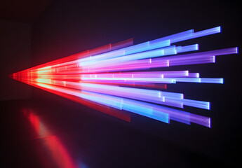 Wall Mural - A vibrant light beam with multiple colors of red, blue, and purple against a black background.