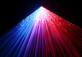 Wall Mural - A vibrant light beam with multiple colors of red, blue, and purple against a black background.