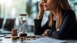 © VINA - A thoughtful woman beside an hourglass and coins, reflecting on time.
