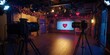 © Chanrothana Pech - A professional broadcast studio with soft, romantic lighting, decorated with subtle Valentine's Day-themed elements like hearts and roses.