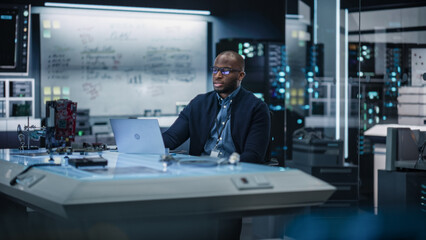 Aufkleber - Portrait of Male African-American Specialist Using Laptop Computer to Improve Electronic Circuit Board in Modern Office. Black Engineer Thinking and Typing Ideas for Artificial Intelligence Project 