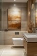 © Worawee - A bathroom with a toilet, sink, and a framed painting on the wall