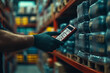 © Dzmitry - Warehouse worker scans inventory in a bustling storage facility during daylight