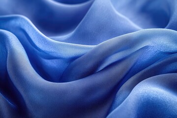 Poster - Elegant blue silk fabric flowing smoothly, creating soft waves