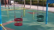 © shufilm - Toddler swing at public park playground